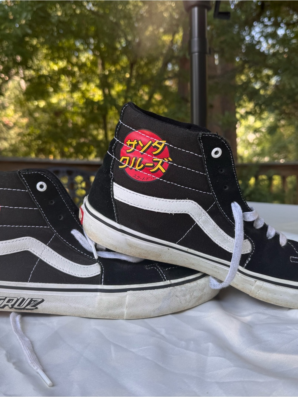 Vans Black and White High-Top Sneakers with Red and Yellow Logo